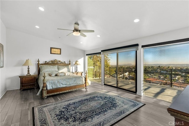 bedroom featuring vaulted ceiling, ceiling fan, access to exterior, and hardwood / wood-style floors