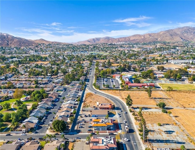 birds eye view of property with a mountain view