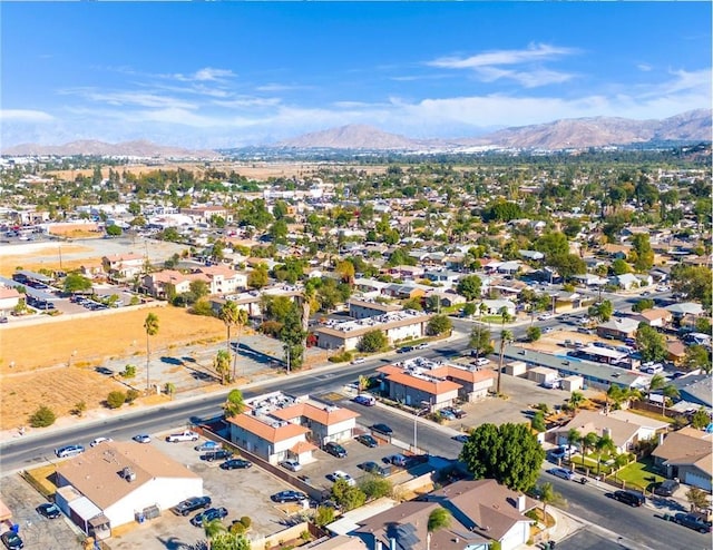 birds eye view of property with a mountain view