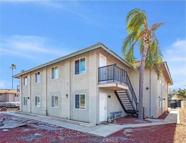 exterior space with a balcony and central AC