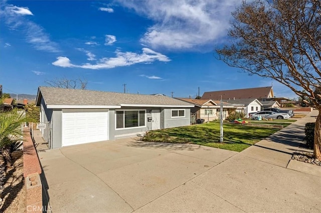 single story home featuring a front yard and a garage