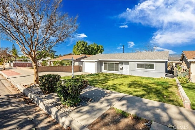 ranch-style house with a garage and a front yard