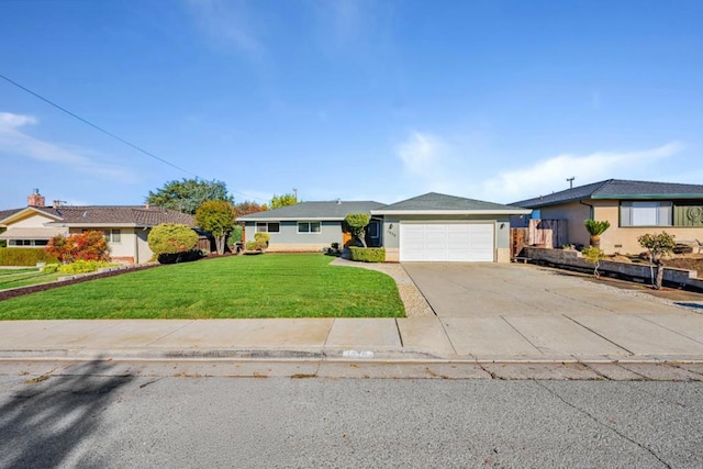 ranch-style house featuring a front lawn and a garage