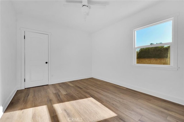 spare room featuring ceiling fan and light hardwood / wood-style floors