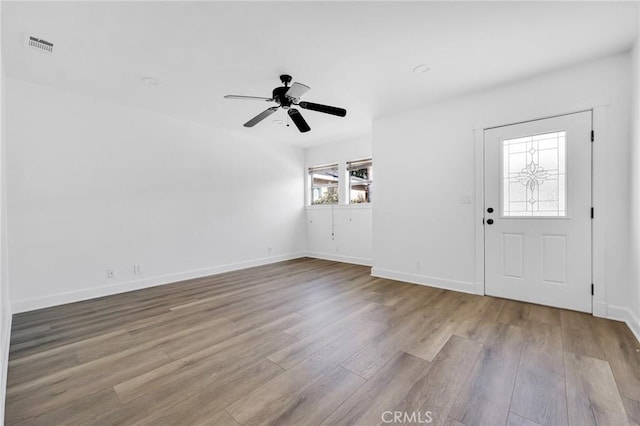 entrance foyer with light hardwood / wood-style flooring and ceiling fan