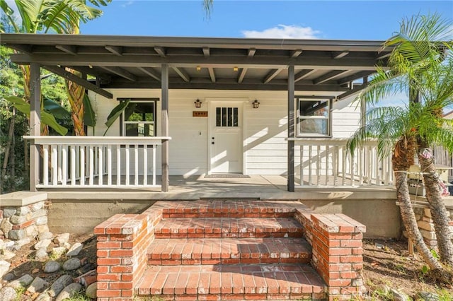 entrance to property with covered porch