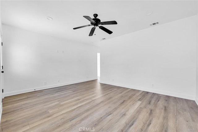 empty room with ceiling fan and light wood-type flooring