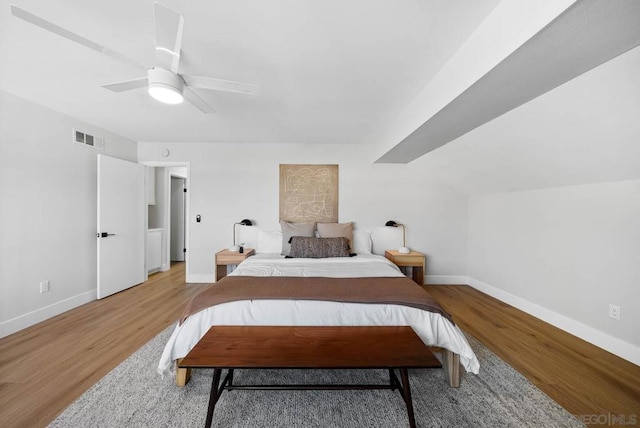 bedroom featuring light wood-type flooring and ceiling fan