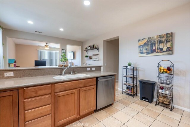 kitchen with ceiling fan, dishwasher, sink, and light tile patterned floors