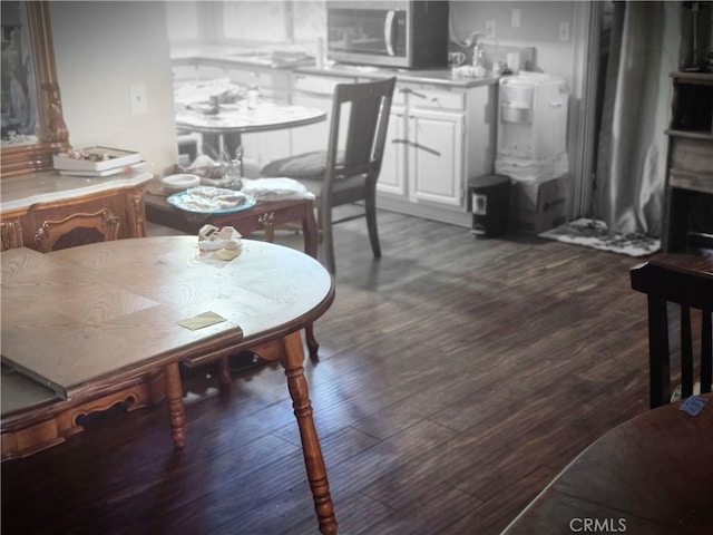 dining area featuring dark hardwood / wood-style flooring