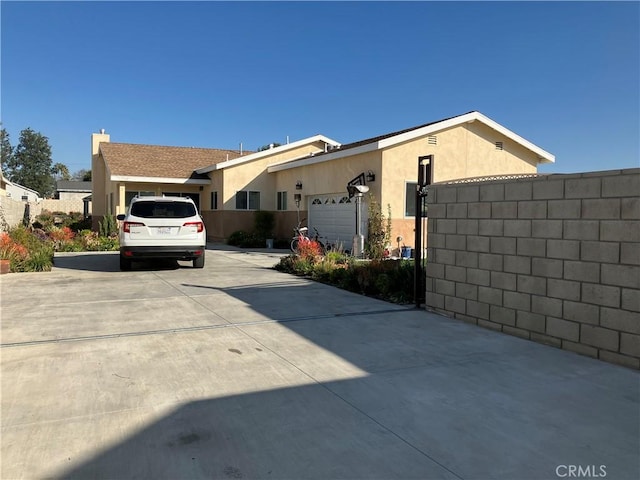 view of side of home with a garage