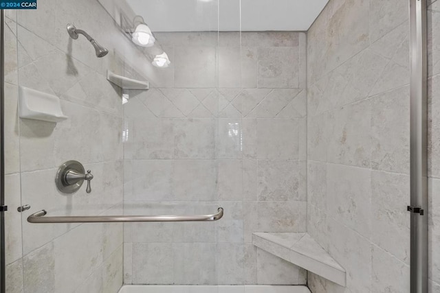 bathroom with a shower with shower door