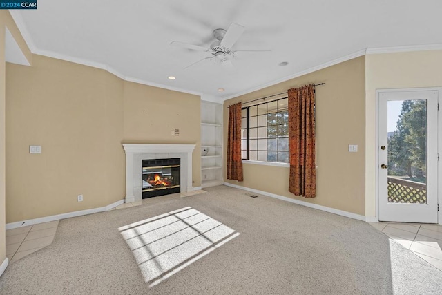 unfurnished living room with built in shelves, ceiling fan, crown molding, and light tile patterned flooring