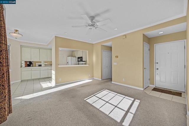 unfurnished living room with light carpet, ceiling fan, and ornamental molding