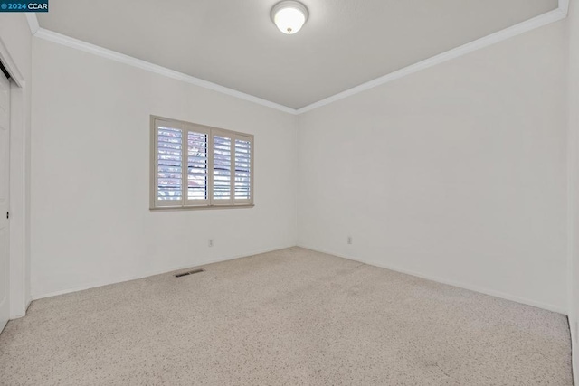 unfurnished room with ornamental molding