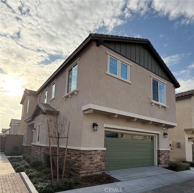 view of side of home with a garage