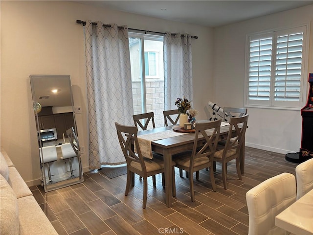 dining space featuring dark hardwood / wood-style floors