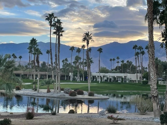 view of home's community featuring a yard and a water and mountain view