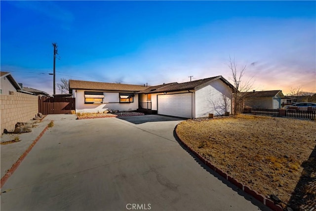 single story home featuring a garage