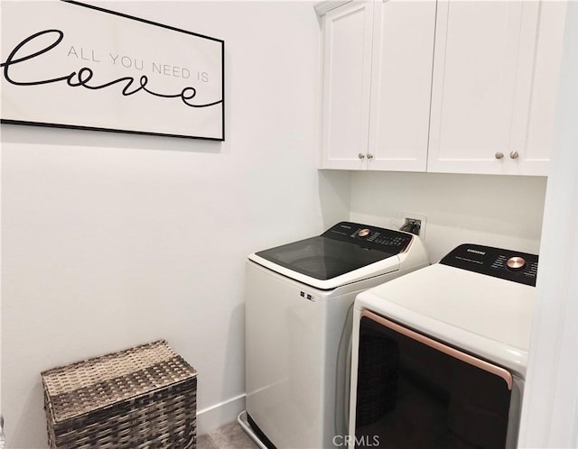 laundry area featuring cabinets and washer and dryer