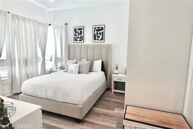 bedroom featuring wood-type flooring