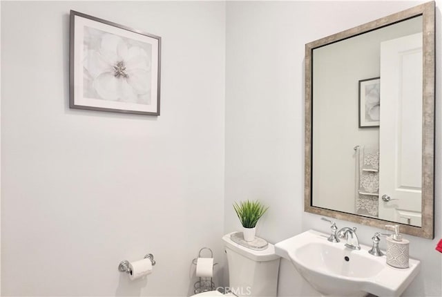 bathroom with sink and toilet