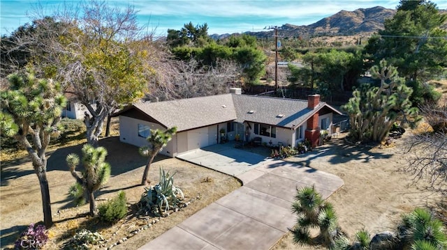 birds eye view of property featuring a mountain view