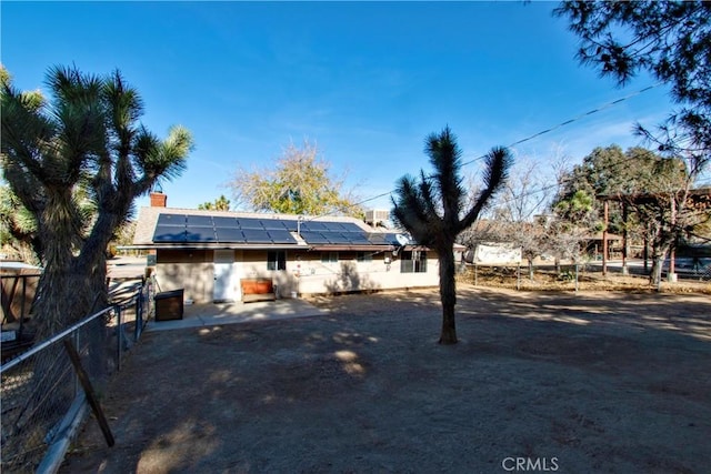 exterior space featuring solar panels