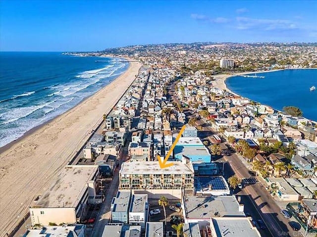 bird's eye view with a view of the beach and a water view