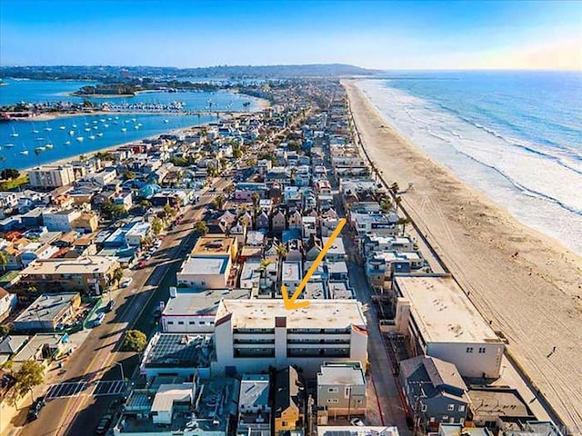 bird's eye view featuring a view of the beach and a water view