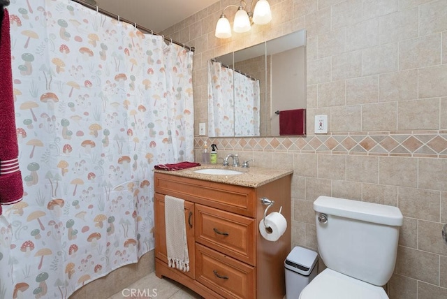 1417 W Gage Ave, Los Angeles, CA 90047 - bathroom with tile walls, vanity, a shower with curtain, and tile patterned floors