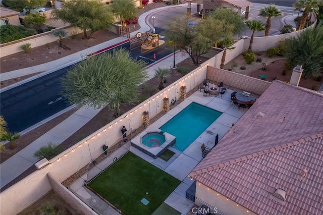 view of pool with an in ground hot tub and a patio area