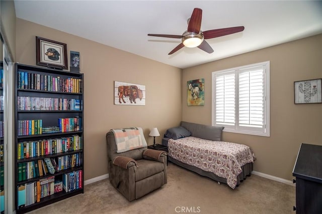 bedroom with light colored carpet and ceiling fan