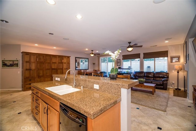 kitchen featuring a kitchen breakfast bar, black dishwasher, sink, and a center island with sink