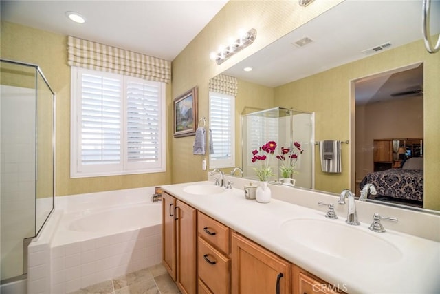 bathroom featuring vanity and plus walk in shower