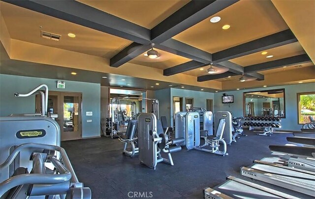 workout area featuring coffered ceiling