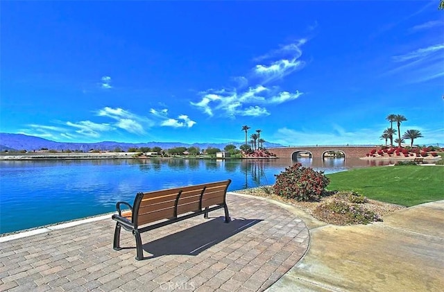 view of home's community featuring a water and mountain view