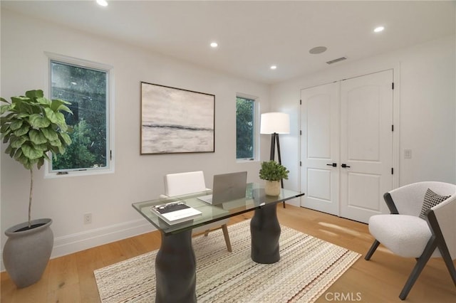 office space with light wood-type flooring