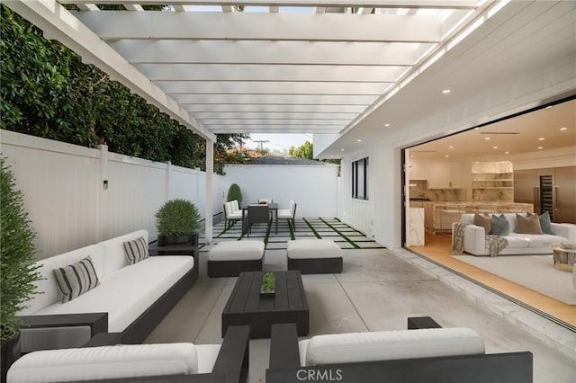 view of patio with an outdoor living space and a pergola