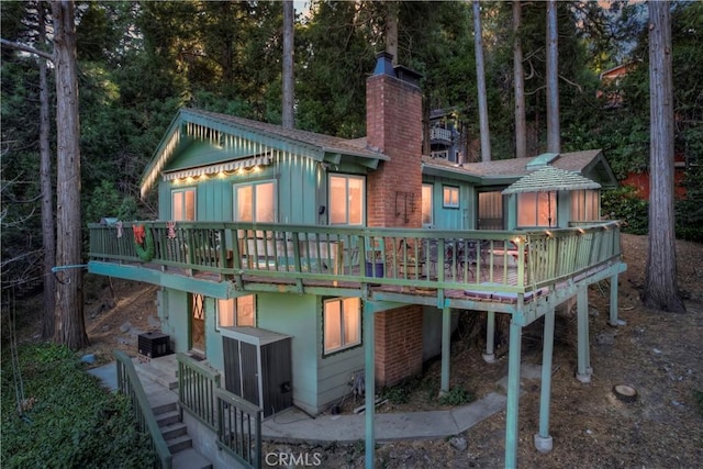 back of property featuring a wooden deck