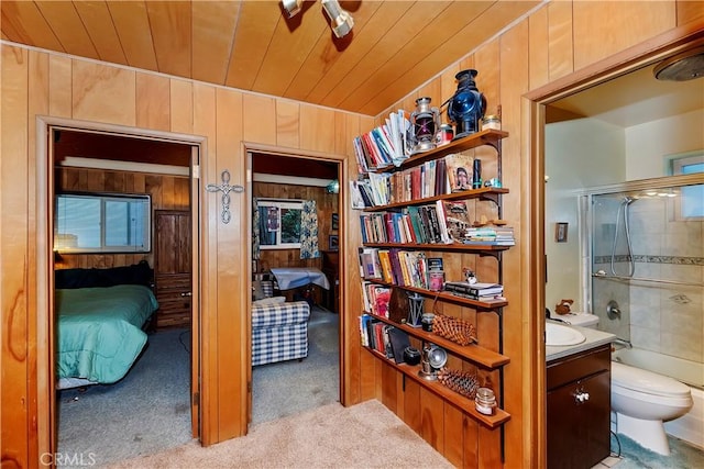 interior space featuring wooden walls, light colored carpet, and wooden ceiling