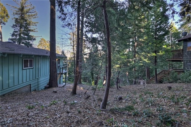 yard at dusk with a deck