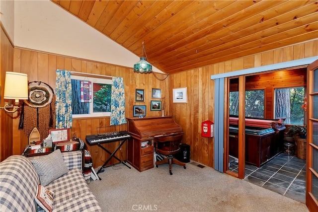 interior space with wooden walls, wooden ceiling, lofted ceiling, and dark colored carpet