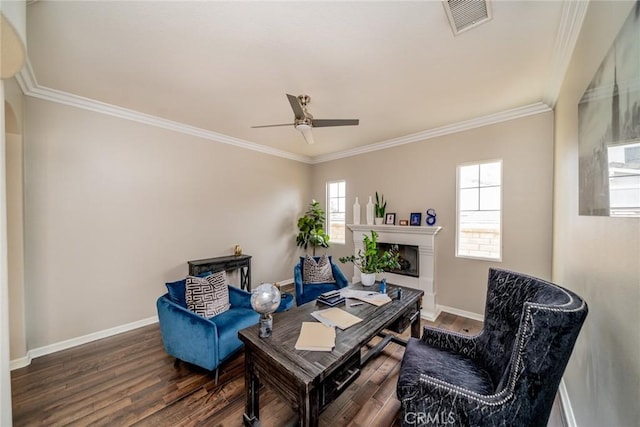 sitting room featuring dark hardwood / wood-style floors, ceiling fan, and crown molding