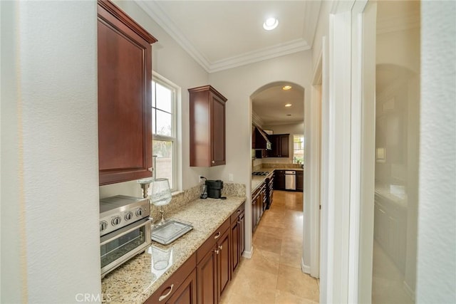 kitchen featuring light stone countertops, stainless steel appliances, light tile patterned floors, exhaust hood, and ornamental molding