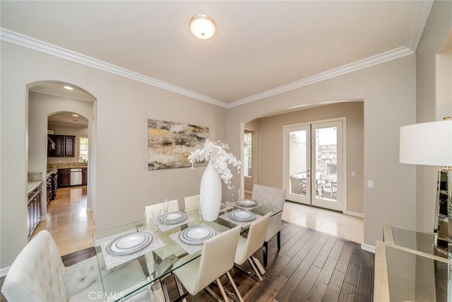 dining room with hardwood / wood-style flooring and ornamental molding