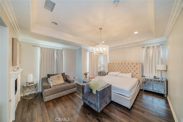 bedroom with ornamental molding, dark wood-type flooring, and a notable chandelier