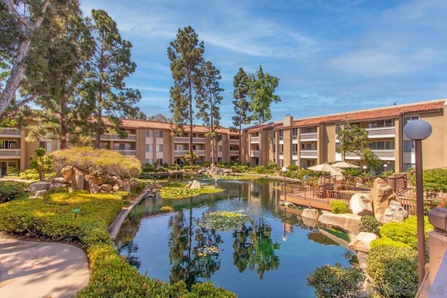 view of home's community featuring a water view