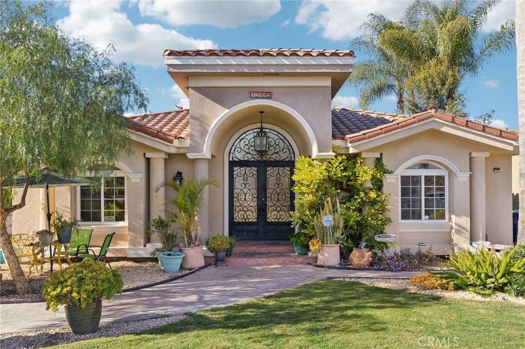 entrance to property featuring french doors