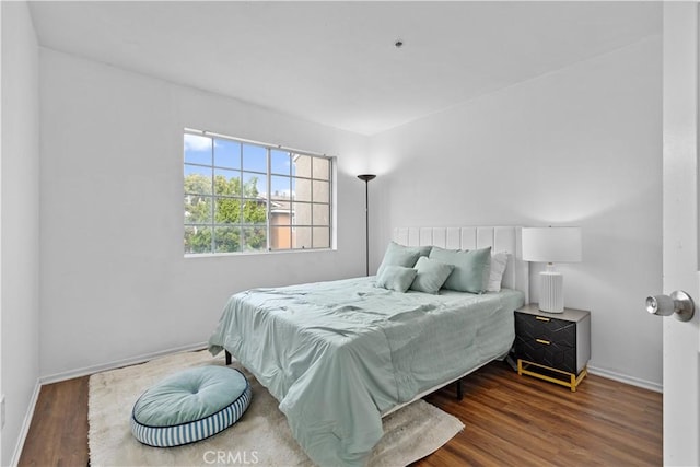 bedroom featuring dark hardwood / wood-style flooring